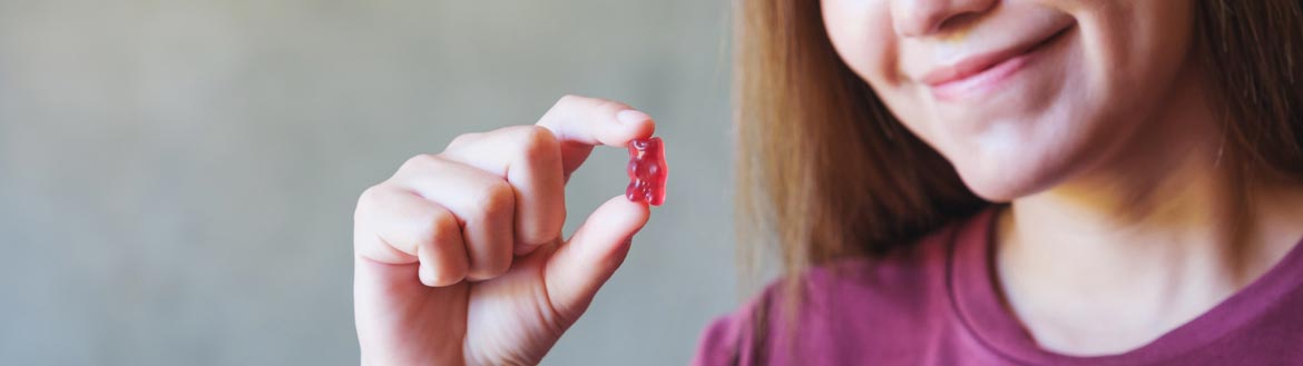Woman holding gummy product