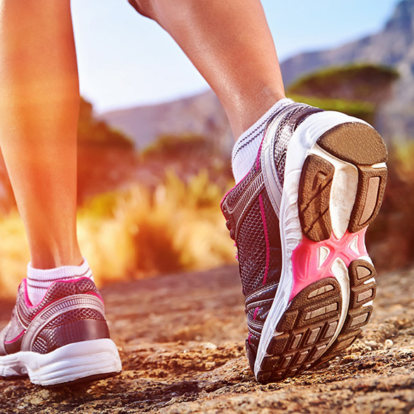 Woman Feet in Running Shoes on Outdoor Dirt Trail